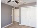 This bedroom has tile floors and bright closet doors for lots of storage at 4835 San Ortebello Dr, Bradenton, FL 34208