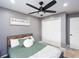 This cozy bedroom features a ceiling fan and comfortable bedding at 4835 San Ortebello Dr, Bradenton, FL 34208