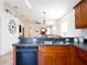Open concept kitchen with a stainless steel double sink and black appliances at 4835 San Ortebello Dr, Bradenton, FL 34208