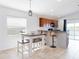 Eat-in kitchen featuring a counter bar with seating and stainless steel appliances at 4835 San Ortebello Dr, Bradenton, FL 34208