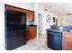 Kitchen featuring stainless steel appliances, wood cabinets, and tiled floors at 4835 San Ortebello Dr, Bradenton, FL 34208