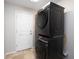Convenient laundry area with stacked washer and dryer for space-saving efficiency at 4835 San Ortebello Dr, Bradenton, FL 34208