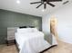 Spacious main bedroom with accent wall and an attached bathroom with shower at 4835 San Ortebello Dr, Bradenton, FL 34208