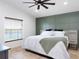 Bright main bedroom with a decorative accent wall and a ceiling fan at 4835 San Ortebello Dr, Bradenton, FL 34208
