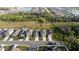 Aerial view of a residential street with modern homes, driveways, and manicured lawns at 4907 Wedgeleaf Way, Palmetto, FL 34221