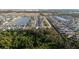 Community aerial view featuring a peaceful lake, green spaces, and numerous homes at 4907 Wedgeleaf Way, Palmetto, FL 34221