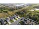 Aerial view of homes, manicured lawns, and driveways in a vibrant community near natural habitat at 4907 Wedgeleaf Way, Palmetto, FL 34221