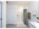 Clean bathroom featuring a stand-up shower, modern fixtures, and convenient towel storage at 4907 Wedgeleaf Way, Palmetto, FL 34221