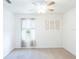 Bedroom with white walls, a ceiling fan, and six framed images at 4907 Wedgeleaf Way, Palmetto, FL 34221
