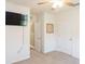 Bedroom with a ceiling fan, a TV, and light-colored carpet at 4907 Wedgeleaf Way, Palmetto, FL 34221