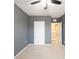 Bedroom featuring gray walls, neutral carpet, and white doors at 4907 Wedgeleaf Way, Palmetto, FL 34221