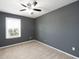 Bedroom featuring gray walls and neutral carpet at 4907 Wedgeleaf Way, Palmetto, FL 34221