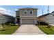 Charming two-story home with a well-manicured lawn and inviting curb appeal at 4907 Wedgeleaf Way, Palmetto, FL 34221