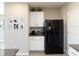 Contemporary kitchen featuring white cabinetry, stainless steel appliances, and granite countertops at 4907 Wedgeleaf Way, Palmetto, FL 34221