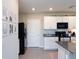 Modern kitchen with stylish backsplash, stainless steel appliances, and granite countertops at 4907 Wedgeleaf Way, Palmetto, FL 34221