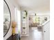 Inviting living room featuring an open floor plan, modern decor, and a stylish decorative shelving unit at 4907 Wedgeleaf Way, Palmetto, FL 34221