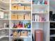Organized pantry features built in shelving and woven baskets for optimal storage space at 4907 Wedgeleaf Way, Palmetto, FL 34221