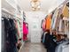 Spacious walk-in closet with custom shelving, ample storage, and decorative lighting features at 4907 Wedgeleaf Way, Palmetto, FL 34221