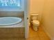 Toilet near a bathtub in a bathroom at 5384 Layton Dr, Venice, FL 34293