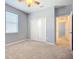 Bedroom featuring a large window, spacious closet, and neutral carpet at 5384 Layton Dr, Venice, FL 34293