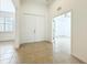 Spacious foyer with light tile floors leads to bedrooms and a bonus room at 5384 Layton Dr, Venice, FL 34293