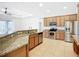 Spacious kitchen features granite countertops and stainless steel appliances at 5384 Layton Dr, Venice, FL 34293