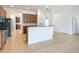 Open concept kitchen with stainless steel appliances, granite countertops, and light wood cabinets at 5384 Layton Dr, Venice, FL 34293