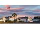 Exterior evening view of a circle woods clubhouse with American flag and palm tree at 595 Circlewood Dr # Y4, Venice, FL 34293