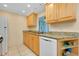 Bright and clean kitchen featuring granite countertops and natural cabinetry at 595 Circlewood Dr # Y4, Venice, FL 34293