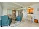 Bright Florida room open to dining area and kitchen, features tile floors and a ceiling fan at 595 Circlewood Dr # Y4, Venice, FL 34293