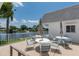 Outdoor patio with comfortable seating and lovely lake views, perfect for relaxing at 595 Circlewood Dr # Y4, Venice, FL 34293