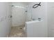 Beautiful bathroom featuring a tiled stand-up shower with glass block window at 8132 Coco Solo Ave, North Port, FL 34287