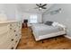 Bright bedroom with hardwood floors, ceiling fan, and natural light at 8132 Coco Solo Ave, North Port, FL 34287
