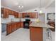 Modern kitchen featuring stainless steel appliances, granite countertops, and ample cabinet space at 8132 Coco Solo Ave, North Port, FL 34287