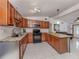 Modern kitchen featuring stainless steel appliances, granite countertops, and ample cabinet space at 8132 Coco Solo Ave, North Port, FL 34287