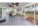 Screened in patio with outdoor furniture overlooking backyard at 8132 Coco Solo Ave, North Port, FL 34287