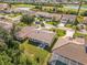 Beautiful aerial view of houses, golf course, and lakes at the gated community at 8300 Parkside Dr, Englewood, FL 34224