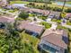 Beautiful aerial view of houses, golf course, and lakes at the gated community at 8300 Parkside Dr, Englewood, FL 34224