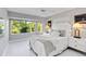 A calming bedroom with a large window showcasing a lush green view at 8300 Parkside Dr, Englewood, FL 34224