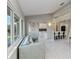 Spacious living room with backyard views, open to kitchen, and with bright natural light at 8300 Parkside Dr, Englewood, FL 34224
