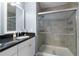 Bathroom featuring granite vanity and glass enclosed shower at 8405 Placida Rd # 206, Placida, FL 33946