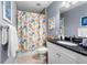Bright bathroom featuring tub with shower and vanity with granite countertop at 8405 Placida Rd # 206, Placida, FL 33946