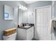 Bathroom features a vanity with granite countertop and a decorative mirror at 8405 Placida Rd # 206, Placida, FL 33946