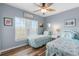 Charming bedroom featuring twin beds with coastal-themed bedding and bright natural light at 8405 Placida Rd # 206, Placida, FL 33946