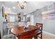 Cozy dining area next to kitchen features a wooden table, comfortable chairs, and modern decor at 8405 Placida Rd # 206, Placida, FL 33946