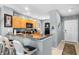 Kitchen with counter seating, granite countertops, and stainless appliances adjacent to the entryway at 8405 Placida Rd # 206, Placida, FL 33946