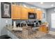 Granite countertops highlight a kitchen with modern appliances and ample cabinet space for cooking needs at 8405 Placida Rd # 206, Placida, FL 33946