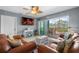 Relaxing living room with access to the balcony, perfect for enjoying the scenic views at 8405 Placida Rd # 206, Placida, FL 33946