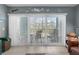 Inviting living room with balcony access and comfortable seating, providing an airy, bright space at 8405 Placida Rd # 206, Placida, FL 33946