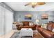 Cozy living room with comfortable leather sofas and beach-themed decor, offering a relaxed coastal atmosphere at 8405 Placida Rd # 206, Placida, FL 33946